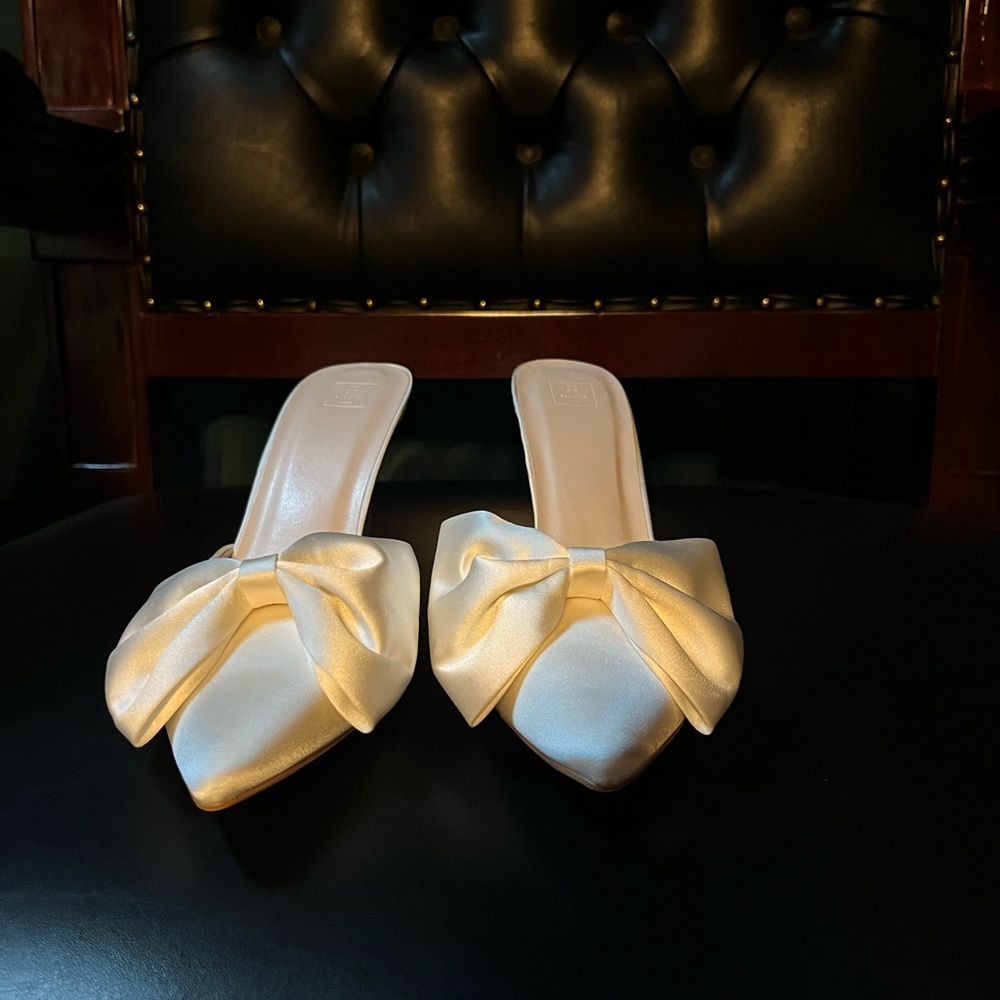 White DB Studio mules with bows